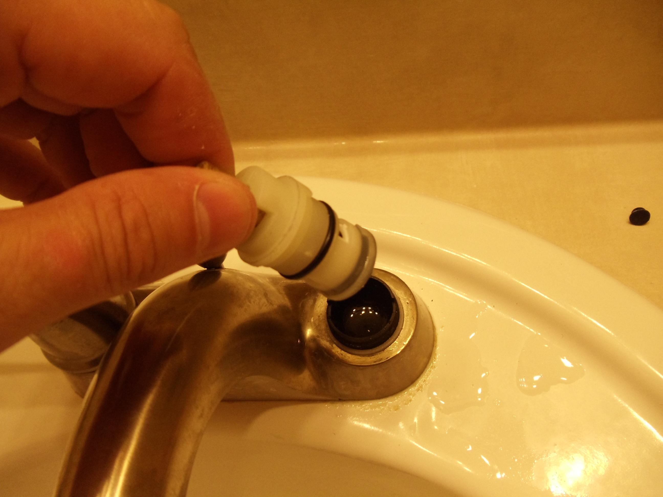bathroom sink leaking from inside faucet