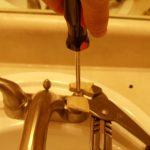 Using screwdriver on faucet